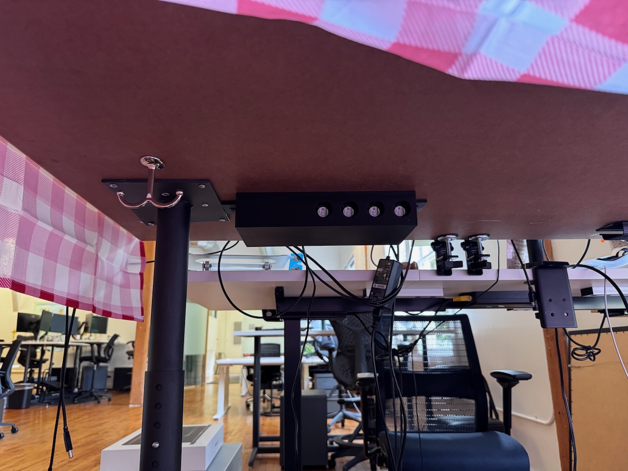Photo of the device mounted under his desk The device mounted under his desk