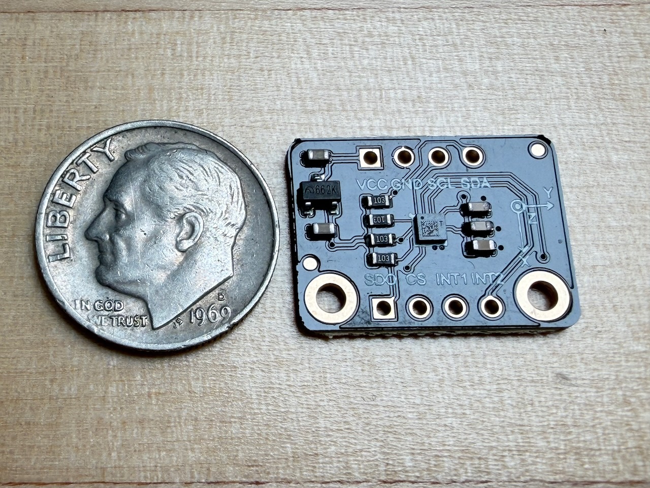 Photo of a LIS2DW12 sensor board next to a dime A LIS2DW12 sensor board next to a grimy dime (Sorry. I only have grimy dimes)