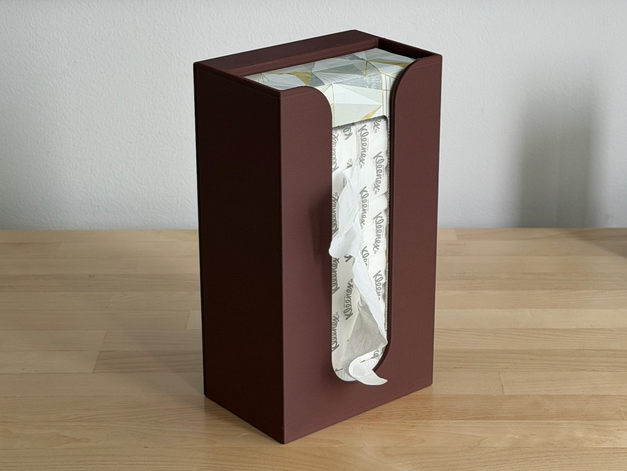 Photo of the assembled BleatBox from the front, with a box of tissues in it Assembled BleatBox, front view